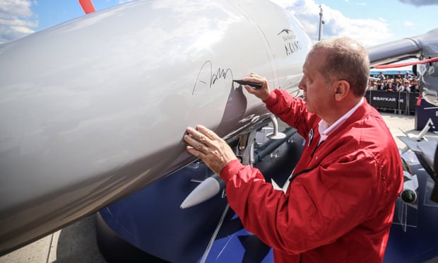 The Turkish president, Recep Tayyip Erdoğan, signs a Bayraktar Akıncı drone at an aerospace festival in Istanbul this month.