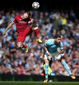 Liverpool’s Alberto Moreno challenges Manchester City’s Kyle Walker during City’s 5-0 win at The Etihad Stadium.