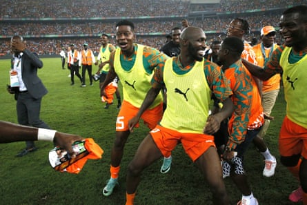 The Ivory Coast players dance with joy after reaching the final in front of their own fans.