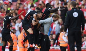 Sadio Mane celebrates scoring Liverpool’s fourth goal with manager Jürgen Klopp, Dejan Lovren and teammates.