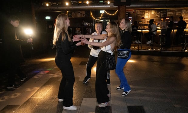 People celebrate on the dance floor of KB nightclub as the coronavirus restrictions are lifted, in Malmo, Sweden.