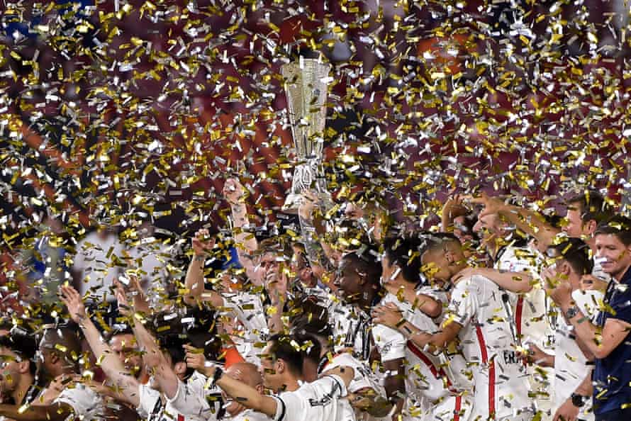 Eintracht Frankfurt players lift the trophy as they celebrate after winning the Europa League final.