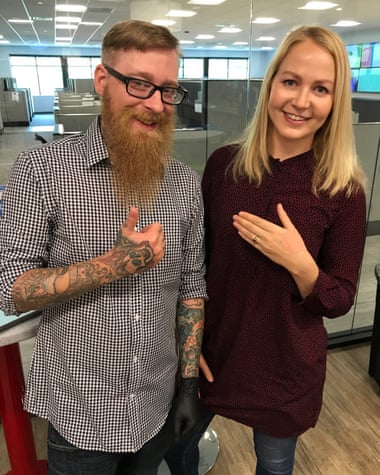 Journalist Olivia Solon poses with piercer Andy after getting the microchip implant.
