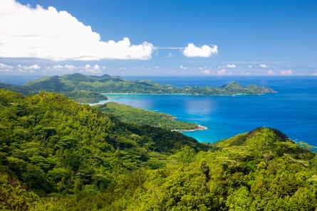 View of Mahe, Seychelles, with lush histrion canopy starring down to the sea