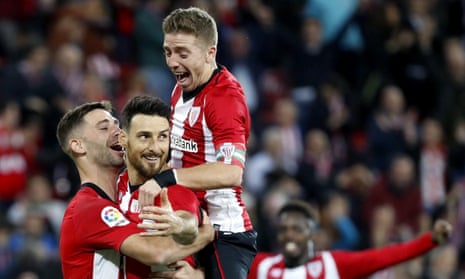 Aritz Aduriz (centre) is congratulated after his penalty against Valladolid.