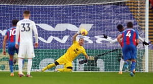 Crystal Palace goalkeeper Vicente Guaita dives to his left to deny Leicester City’s Kelechi Iheanacho from the penalty spot.