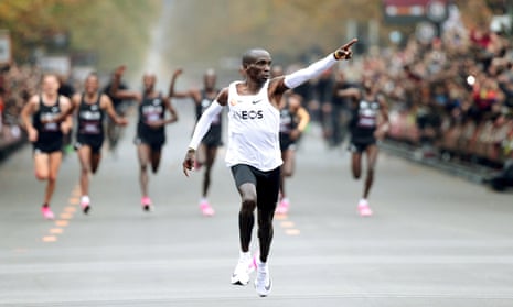 Eliud Kipchoge crosses the finish line wearing Nike Vaporfly shoes during his attempt to run a marathon in under two hours in Vienna.