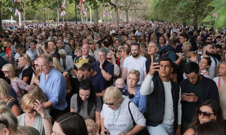 People gather outside Buckingham Palace on Sunday. REUTERS/Marko Djurica