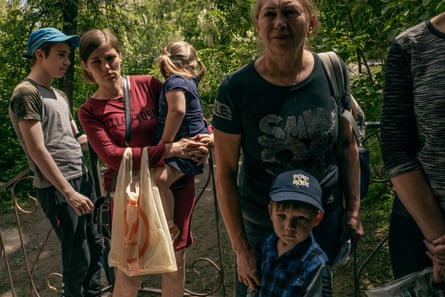 Families with children queueing for aid