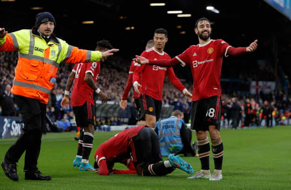 Manchester United’s Anthony Elanga on his knees after being struck by a missile.