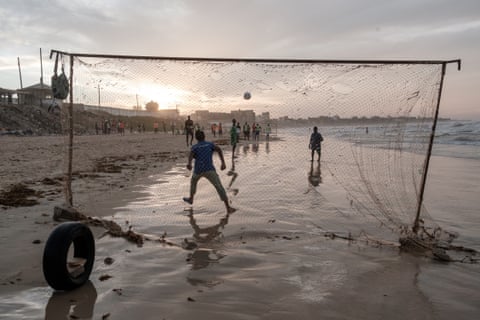 People playing football on Yoff beach in Dakar.