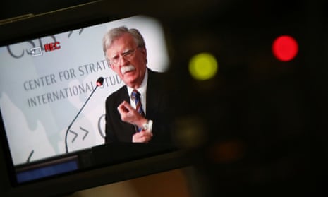 John Bolton is seen in a video camera screen as he delivers remarks at a Washington think tank.