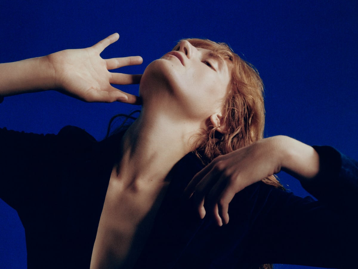 Florence Welch in a moment of introspection, highlighting her artistic depth.