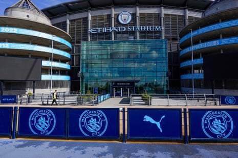 A photo of the front entrance of the Etihad Stadium in Manchester