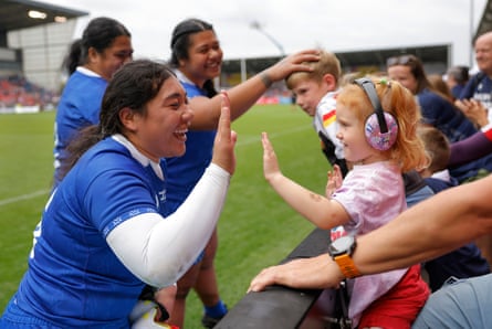 The Samoa replacement hooker Lulu Leuta hi-fives a young fan on a lap of honour after the Women’s Rugby World Cup 2025 Group A match between Australia and Samoa.