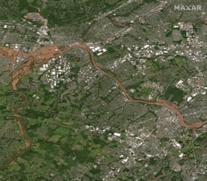 A satellite image shows flooding along the Raritan River in New Jersey