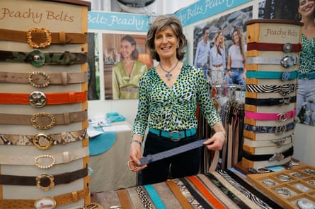 Zoe Gibson at her stand which has belts arranged for display