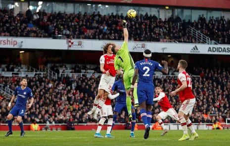 Arsenal’s Bernd Leno tries and fails to punch the ball clear.