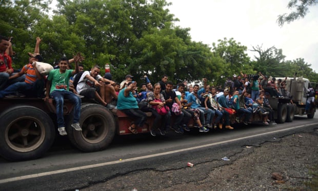 Honduran migrants take part in a caravan towards the United States in Chiquimula, Guatemala, on 17 October.