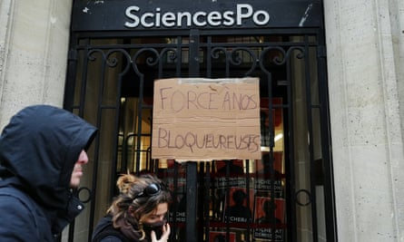 A sign over a gate at Sciences Po reads ‘force to protesters’