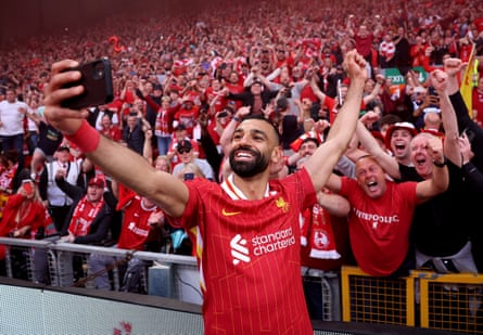Salah in happier times with Liverpool supporters following the Premier League title-winning victory over Tottenham at Anfield in April