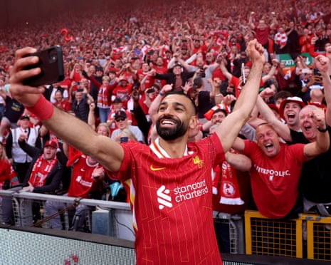 Mohamed Salah takes a selfie with fans after winning the Premier League in 2025