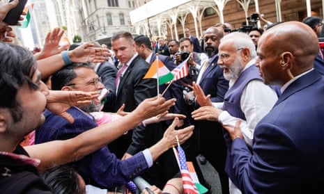 Indian Prime Minister Narendra Modi greets supporters as he arrives in New York on 20 June 2023.