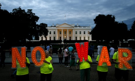 Protesters hold signs spelling out, “No War,” outside the White House, Thursday June 20, 2019, in Washington, after President Donald Trump tweeted that “Iran made a very big mistake” by shooting down a U.S. surveillance drone over the Strait of Hormuz in Iran. (AP Photo/Jacquelyn Martin)