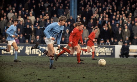 Colin Bell eats up the turf on a breakaway move for Manchester City.