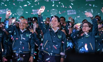 Confetti flies over the stage and crowd as Taiwan's Vice President and presidential-elect from the Democratic Progressive Party (DPP) Lai Ching-te (C) and his running mate Hsiao Bi-khim (Centre R) speak to supporters at a rally in January after winning the general election