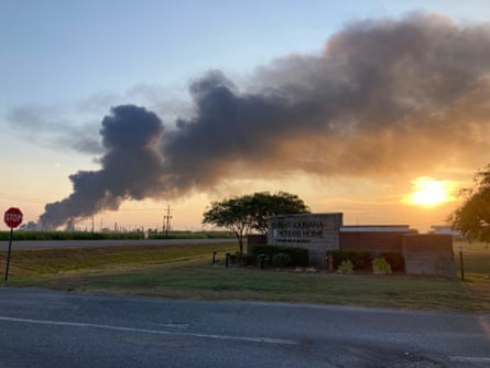 A plume of smoke drifts south-east over a building.