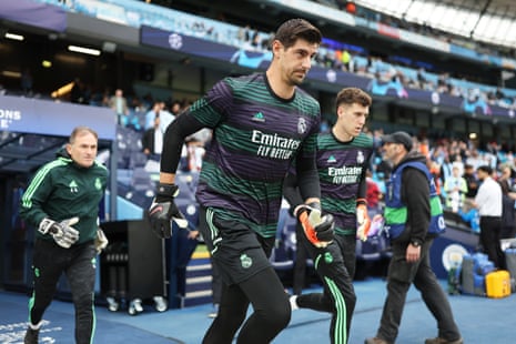 Real Madrid goalkeeper Thibaut Courtois heads out for his warm-up.