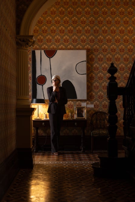 Mostyn, stands in front of an artwork by Paddy Nyunkuny Bedford at Admiralty House in Kirribilli, NSW, Australia