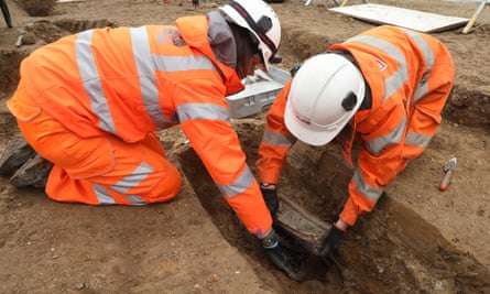 Archaeologists remove the breastplate of Captain Matthew Flinders during workg on London’s HS2 high-speed rail project at Euston