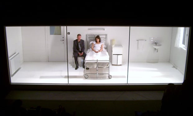 The second act’s ‘alienating glass box’ set