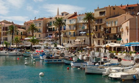 Boats at anchor and the Calvi waterfront, Corsica.