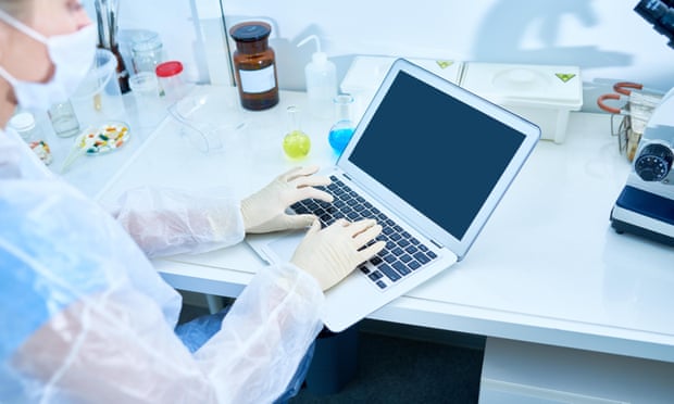 Stock photo of researcher typing scientific article