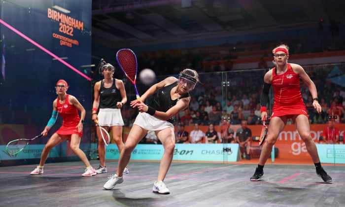 Joelle King (second from left) and Amanda Murphy-Landers (second from right) of New Zealand compete with Sarah-Jane Perry (R) and Alison Waters (L) of England.