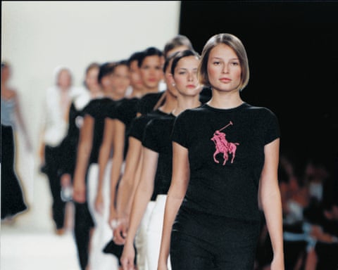 A group of models walking on a runway
