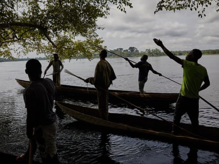 The fisherman of Eala village, led by Patrick Atelo, hunt for a mamba on the river Ruki