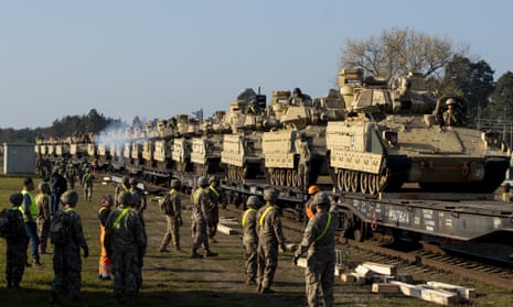 US Bradley fighting vehicles arrive in Lithuania following Russia’s annexation of Crimea in 2014.