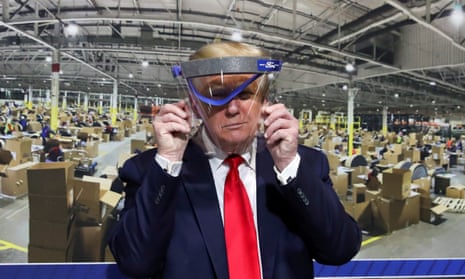 US President Trump visits Ford Rawsonville Components Plant in Ypsilanti, Michiganand holds up a protective face shield during a tour of the plant on May 21, 2020. REUTERS/Leah Millis TPX IMAGES OF THE DAY
