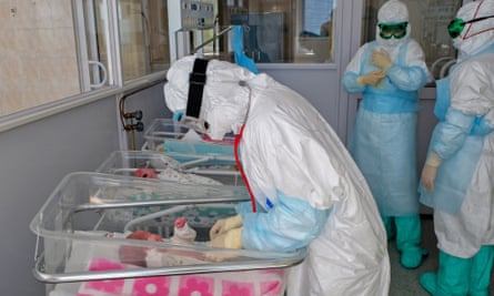 A medical worker examines a newborn baby at a hospital in Khabarovsk.