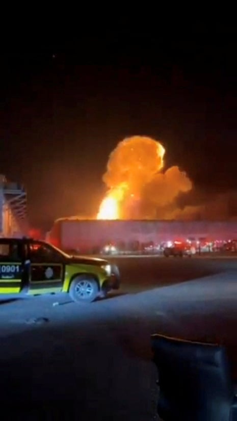 Smoke rises from an explosion following a drone strike on a warehouse in Kuwait, in this still image obtained from social media video.