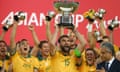 Mile Jedinak lifts the Asian Cup trophy after the Socceroos’ 2-1 victory over South Korea in the final.