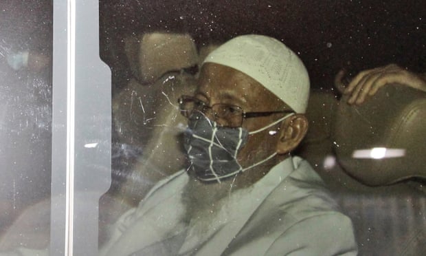 Islamic cleric Abu Bakar Bashir sits inside a van as he leaves upon his release from Gunung Sindur Prison in West Java