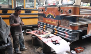 Mechanics refurbishing buses in Ciudad Vieja.