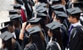 Graduates wait to be photographed after a degree ceremony at Birmingham University in the UK<br>BP3R6K Graduates wait to be photographed after a degree ceremony at Birmingham University in the UK