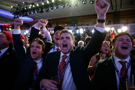Young men raise fists and cheer