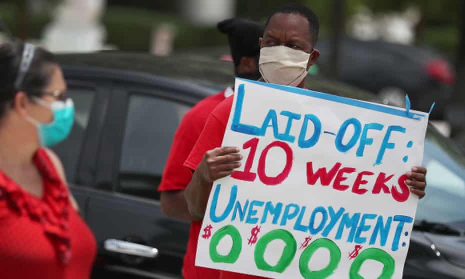 Joseph Louis joins others in a protest asking the state of Florida to fix its unemployment system on 22 May in Miami Beach. Many states are still processing a huge backlog of claims.